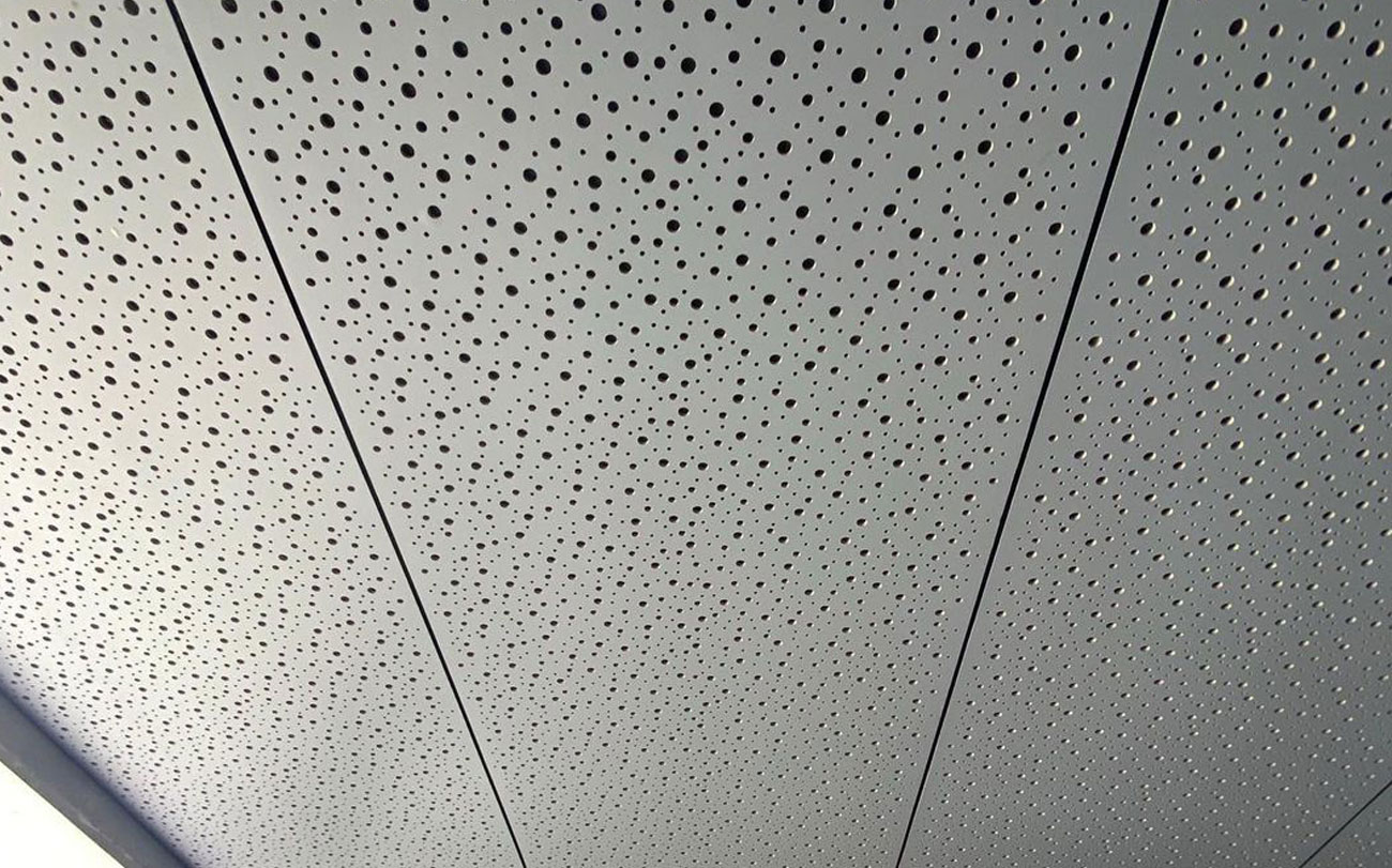 Perforated compressed fibre cement (CFC) acoustic plywood ceiling panels - Merrylands Public School