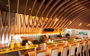 Acoustic panelling on ceilings - the cave restaurant, cnc shaped plywood beams